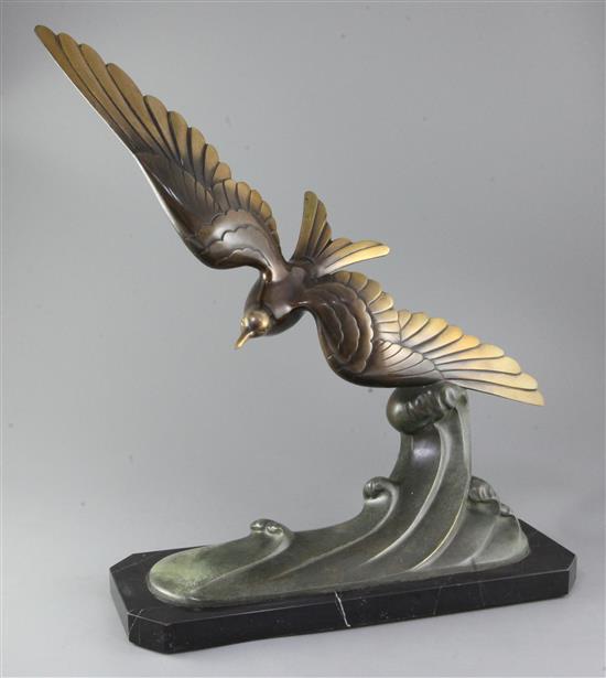 J. Bravet. An Art Deco bronze model of a seagull flying above waves, 19in.